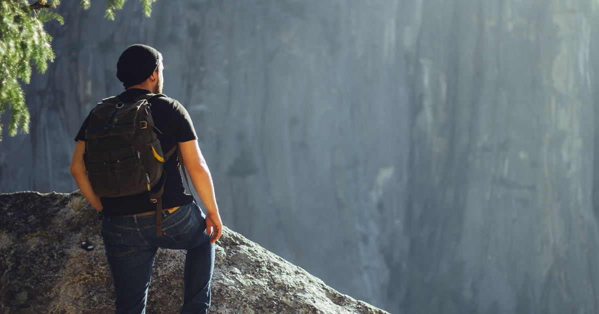 a man wearing black t-shirt ready to take on greater heights