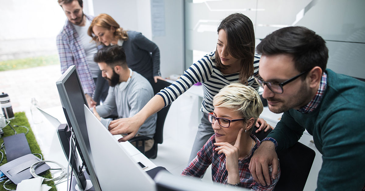 A group of people collaborating in a bustling office space