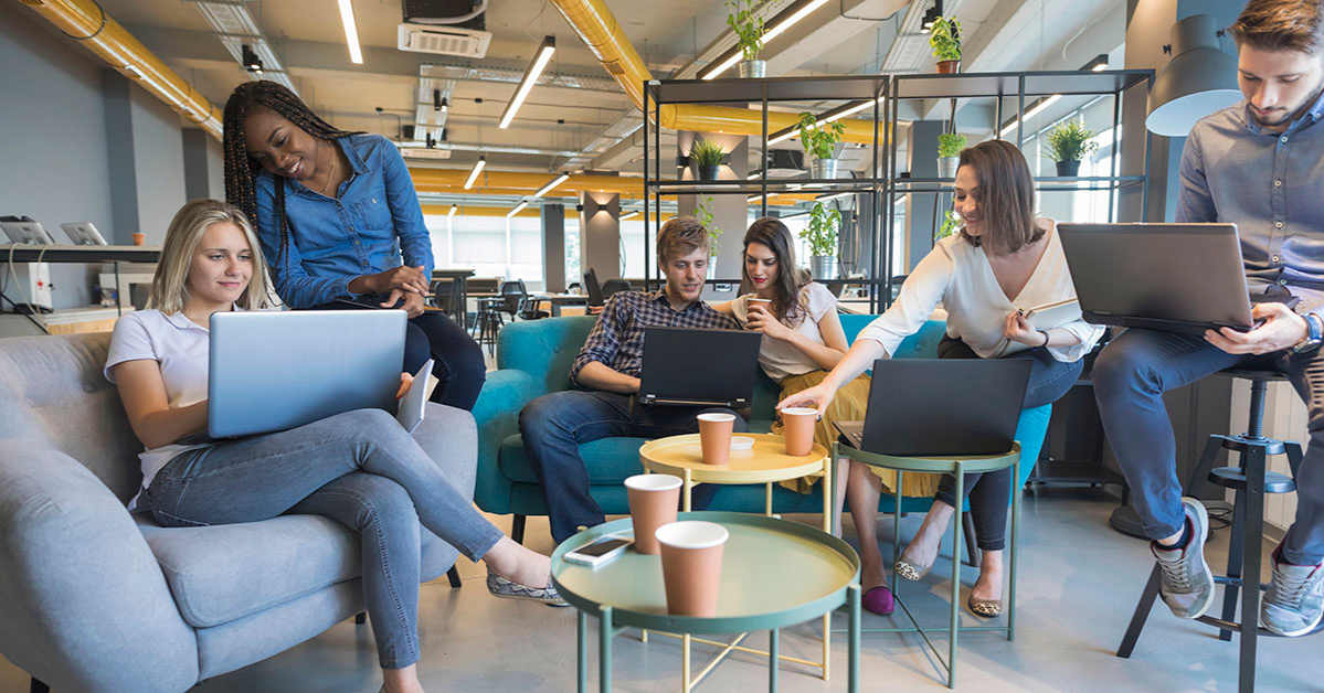 A group of people sits in a modern coworking space