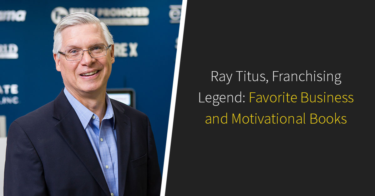 A man in a suit smiles against a blue backdrop. Text reads: “Ray Titus