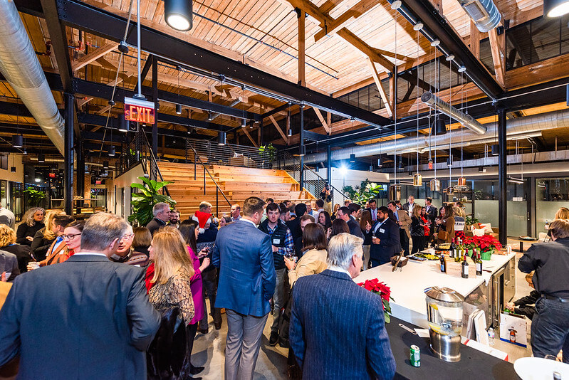 a gathering of professionals in the coworking spaces' event space