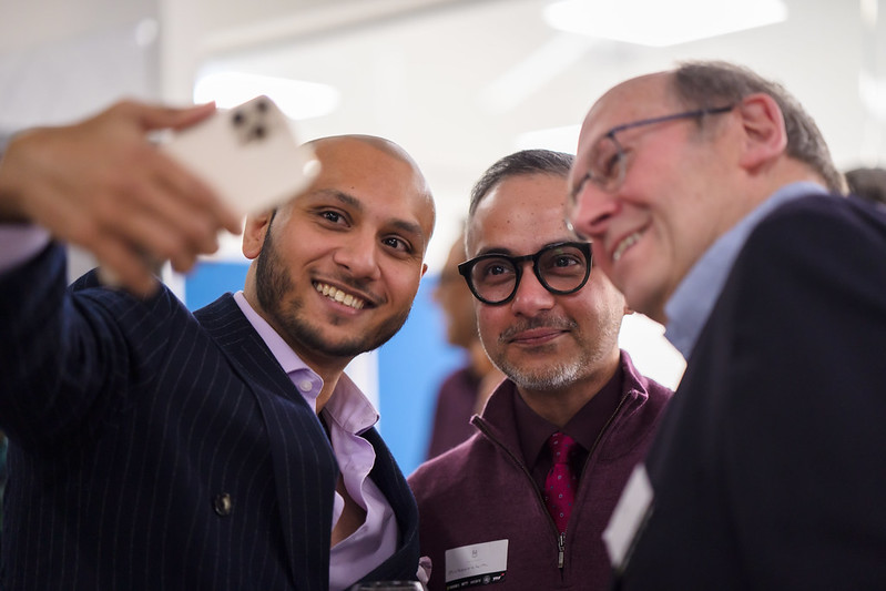 group of people taking selfie during an event in Venture X