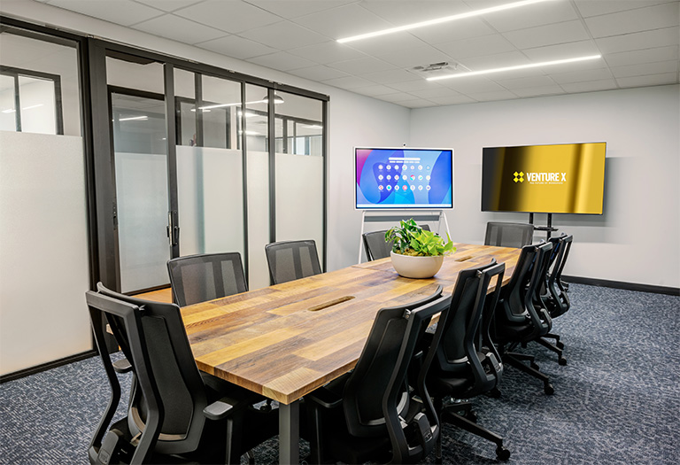 10-person meeting room for rent in San Antonio with modern conference setup, large table, and professional workspace amenities.