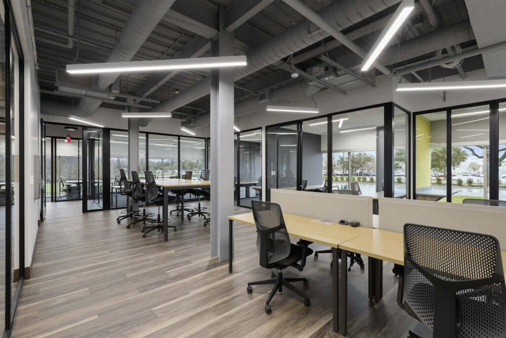 Open-floor coworking spaces and private office space at Venture X in Grapevine, TX
